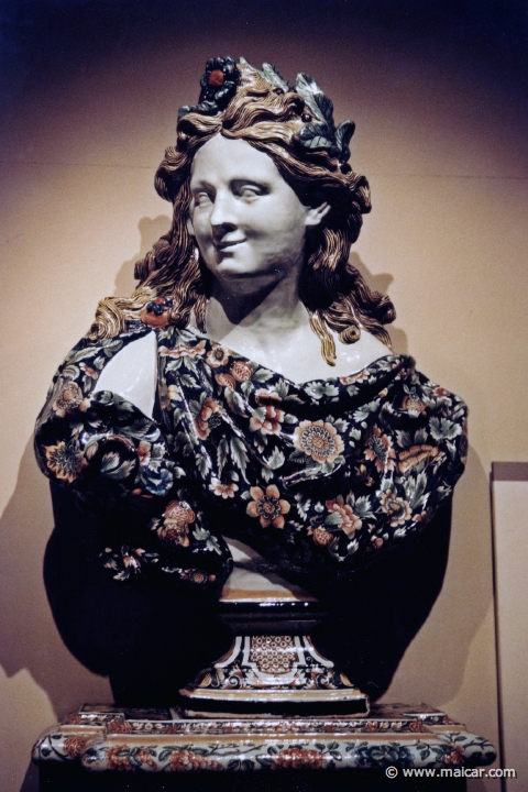7837.jpg - 7837: Bust of Apollo and plinth about 1740. Tin-glazed earthenware. Victoria and Albert Museum, London.