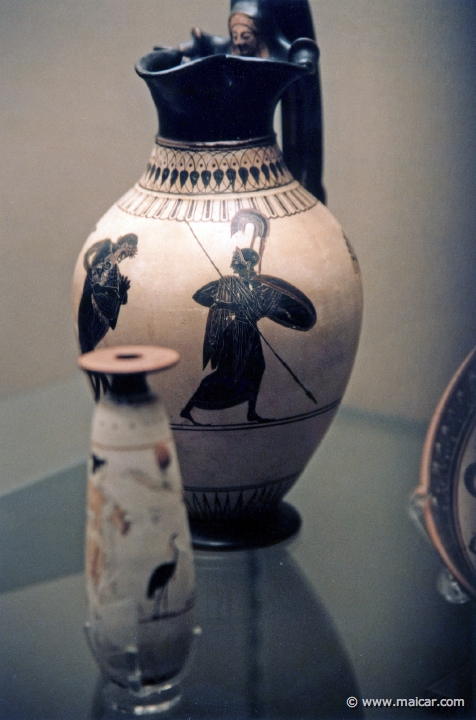 8125.jpg - 8125: White-ground oinochoe (wine-jug). Athens about 520-500 BC. Herakles and the Nemean lion (Athena). British Museum, London.