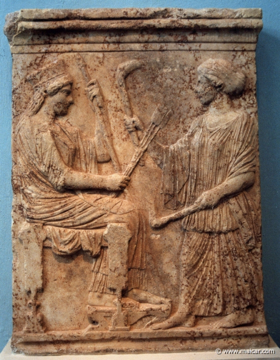 6435.jpg - 6435: Votive relief depicting Demeter seated on a throne and Kore standing and holding torches. First quarter of the 5th century BC. Archaeological Museum of Eleusis.