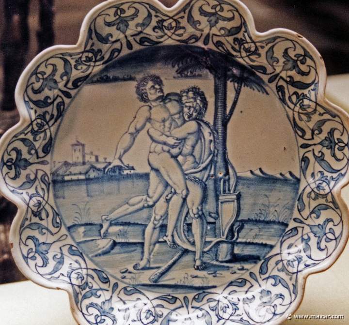 7721.jpg - 7721: Dish with Hercules and Antaeus, about 1540. Tin-glazed and enamelled earthenware. Victoria and Albert Museum, London.