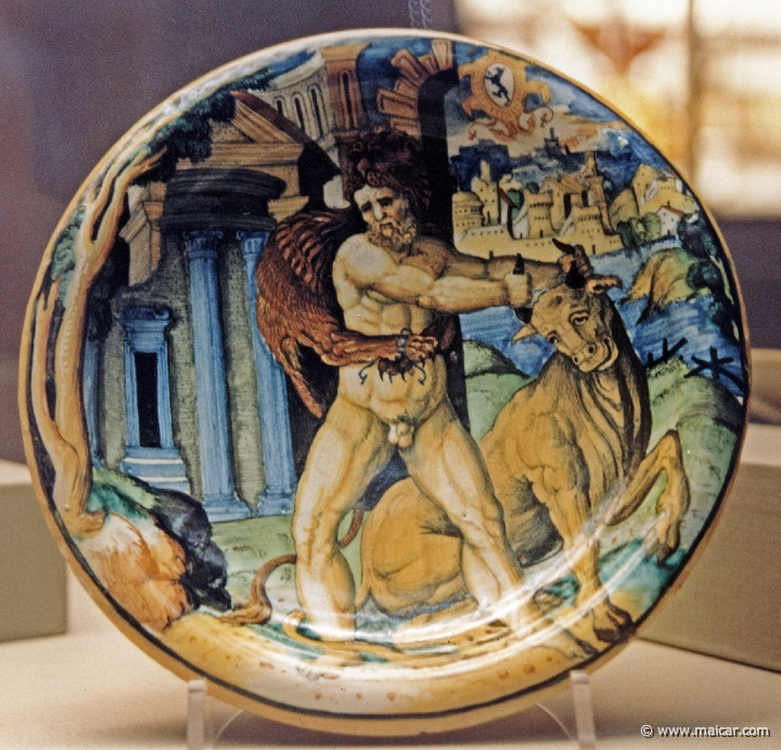 7722.jpg - 7722: Plate showing Heracles wrestling with Achelous about 1540-45. Tin-glazed and enamelled earthenware. Victoria and Albert Museum, London.