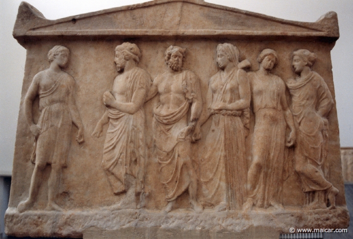 6309.jpg - 6309: Double votive relief. Side B: To the left probably Artemis escorted by a god. In the middle the horned river god Kephissos. To the right 3 nymphs. About 410 BC. National Archaeological Museum, Athens.