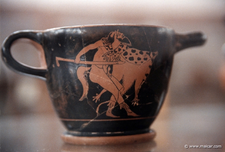 6111.jpg - 6111: Red-figure skyphos. Satyr holding a club of phallic form. Brygos painter c. 489 BC. Archaeological Museum, Thebes.