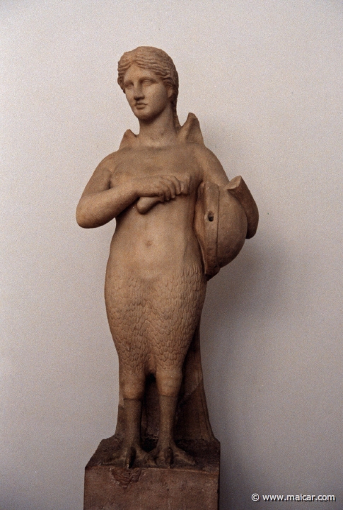 6235.jpg - 6235: Funerary siren. She holds a tortoise shell lyre and a plectrum, 2nd. half of the 4C BC. From the Kerameikos. National Archaeological Museum, Athens.