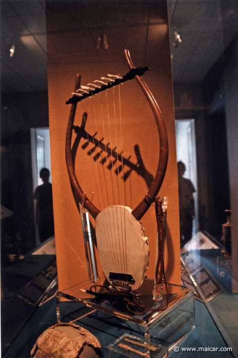 6819.jpg - 6819: Modern reconstruction of an ancient sevenstringed lyre. It has a turtle shell sound box (cheloneio). Made by artist G. Polyzos. Archaeological Museum, Leucas.