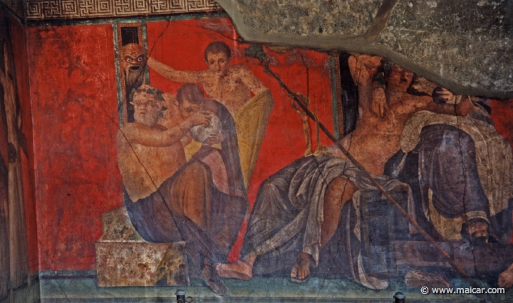 7416.jpg - Villa dei Misteri, Pompeii. From left to right: Silenus giving a drink to a young Satyr, while another Satyr holds up a frightening mask; Dionysus sits with Ariadne; initiates. Pompeii.