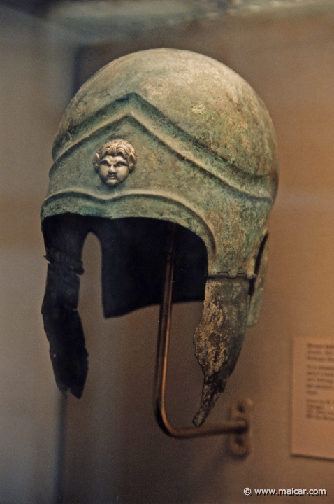8314.jpg - 8314: Bronze helmet of Attic type. Greek 5th century BC, with a silver satyr’s head. British Museum, London.