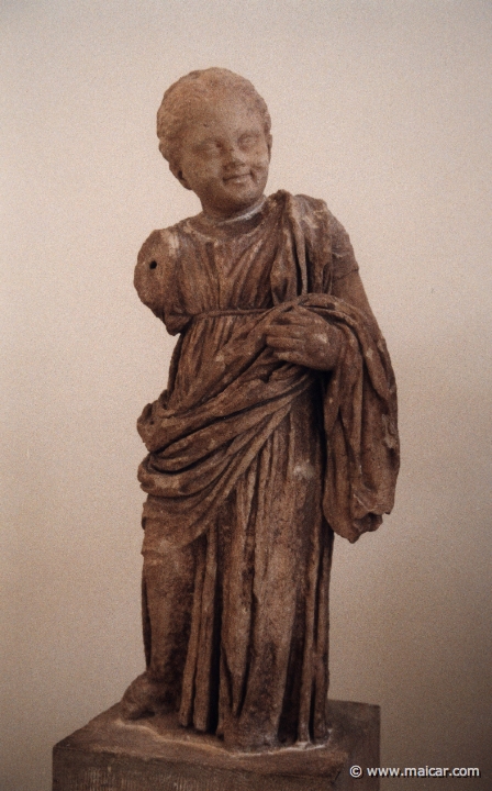 6008.jpg - 6008: Marble statue of a smiling little girl with insert head. Work of early Hellenistic period. Archaeological Museum, Delphi.