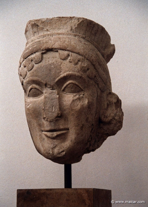 6812.jpg - 6812: Head of the colossal cult statue of Hera originally placed in the Heraeum. Limestone c. 560 BC. Archaeological Museum, Olympia.