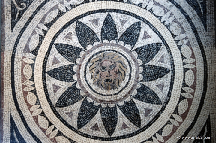 8204.jpg - 8204: Mask of Phobos (fear) within a radiating petal design. 4th century AD. From Halicarnassus. British Museum, London.